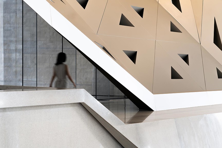 A person walking up a staircase.